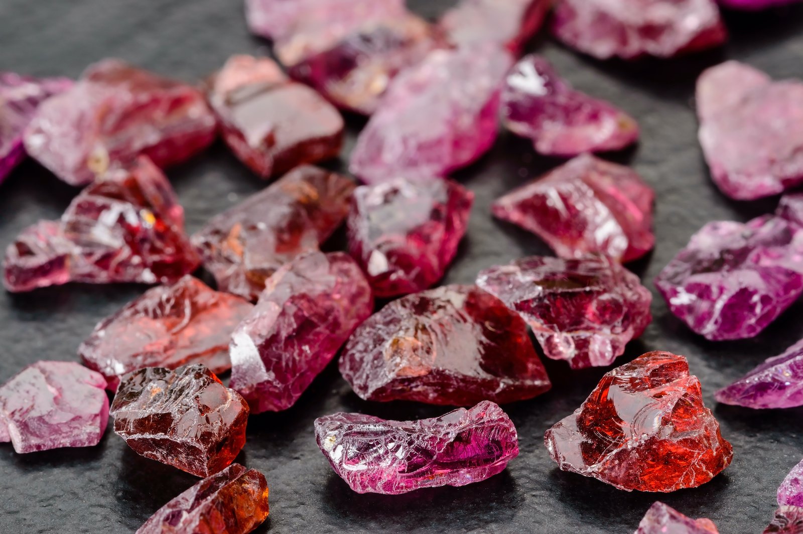 A collection of raw garnet stones