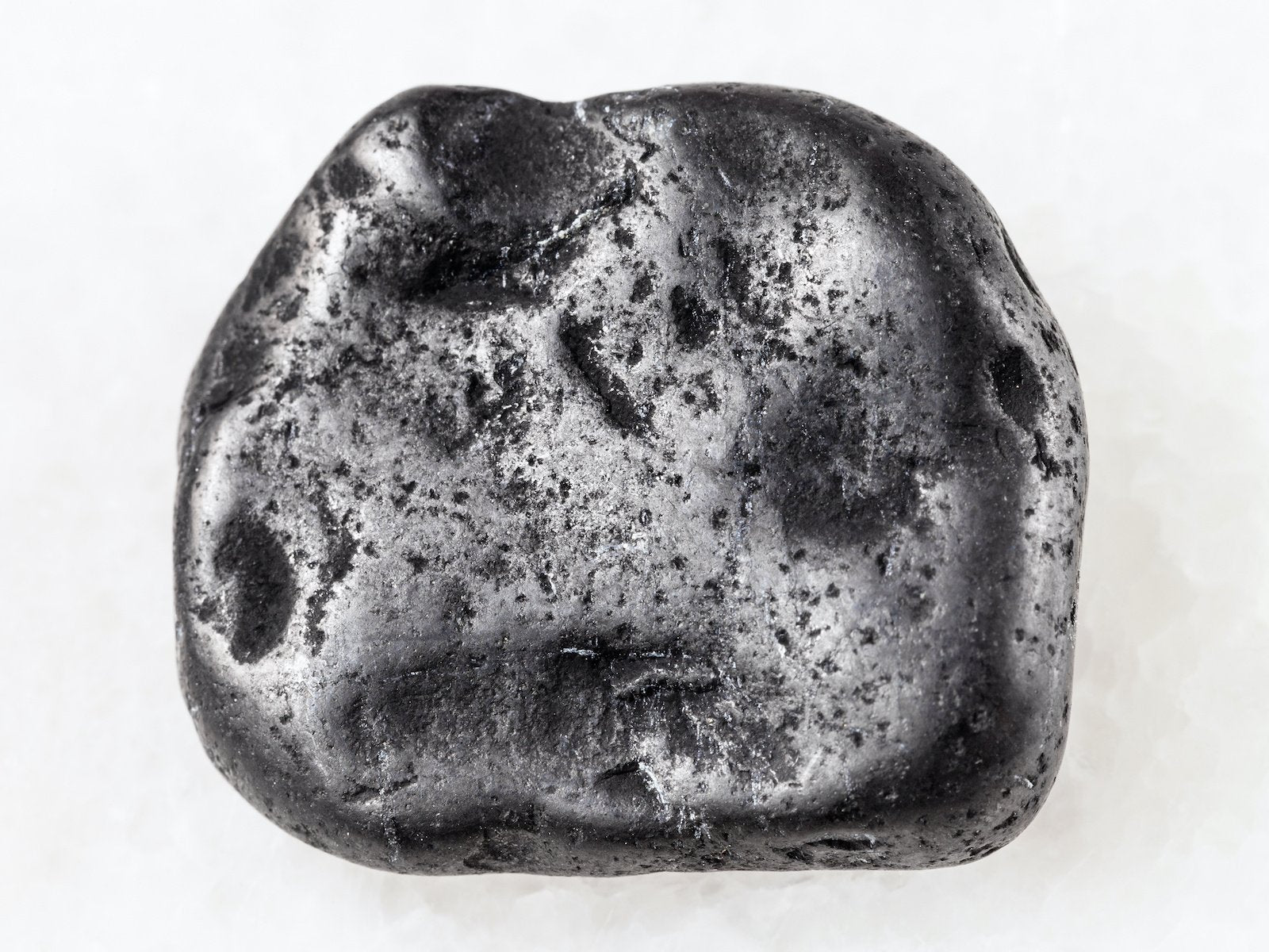A polished raw shungite stone